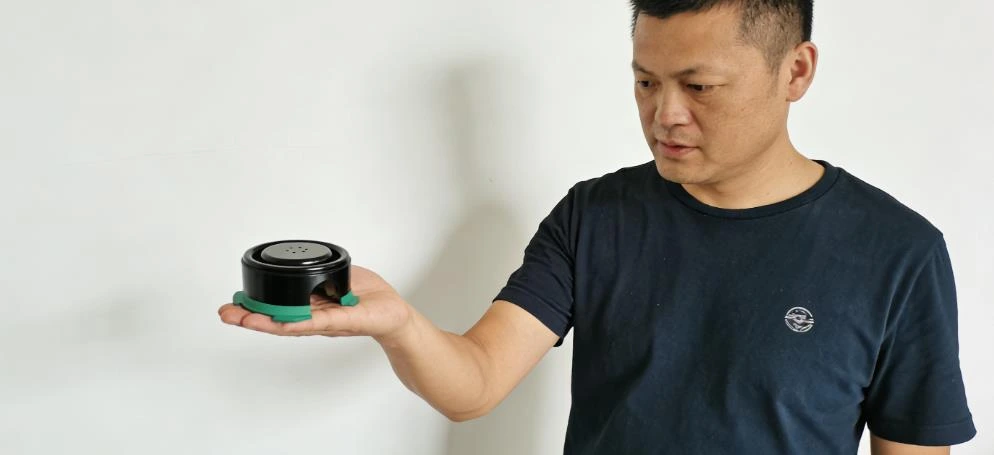 engineer inspecting two shot molded part