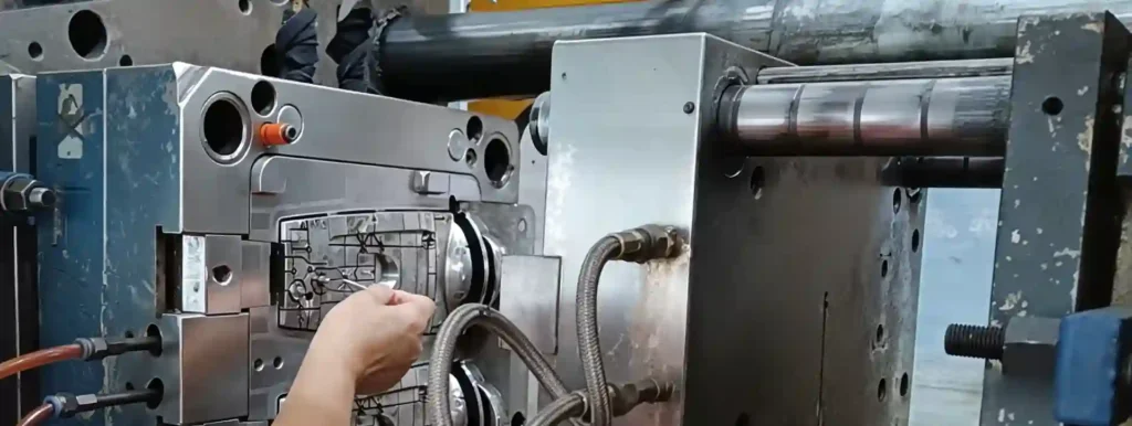 insert loading onto injection mold by hand
